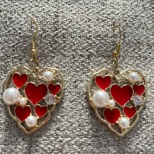 Beautiful Heart shape Pearl with red enamel rhinestone setting.